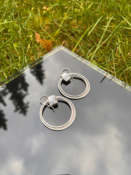 Snowball Chalcedony  with dendrite, 1.5" diameter shadowbox hoops hang from handcrafted ear wires.&nbsp;